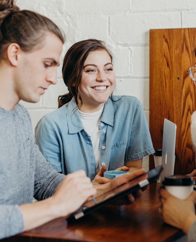A team collaborating in a bright, modern workplace